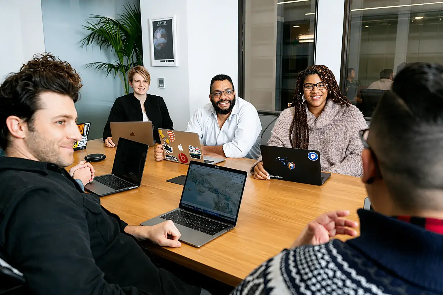 People working around a meeting table